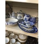 A quantity of blue and white pottery including trinket boxes, jug, platters etc