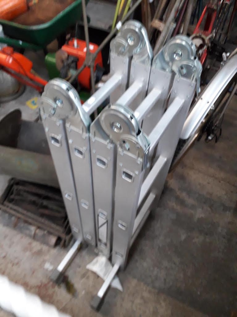 A set of folding aluminium ladders.