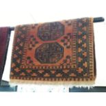 A vintage Eastern hand knotted wool carpet, orange ground 128cm x 78cm (approx)