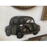 A metal wall hanging VW Beetle