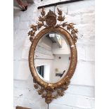 A late 19th century/ early 20th century French gilt framed mirror, 39cm x 70cm.