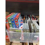 A box of steam railway related DVDs and a box of general DVDs.