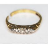A five stone diamond ring, marked '18ct', band cut, gross wt. 2.26g.