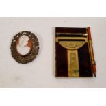 A hallmarked vintage gilded silver cameo brooch and an early 20th century ladies notelet or dance