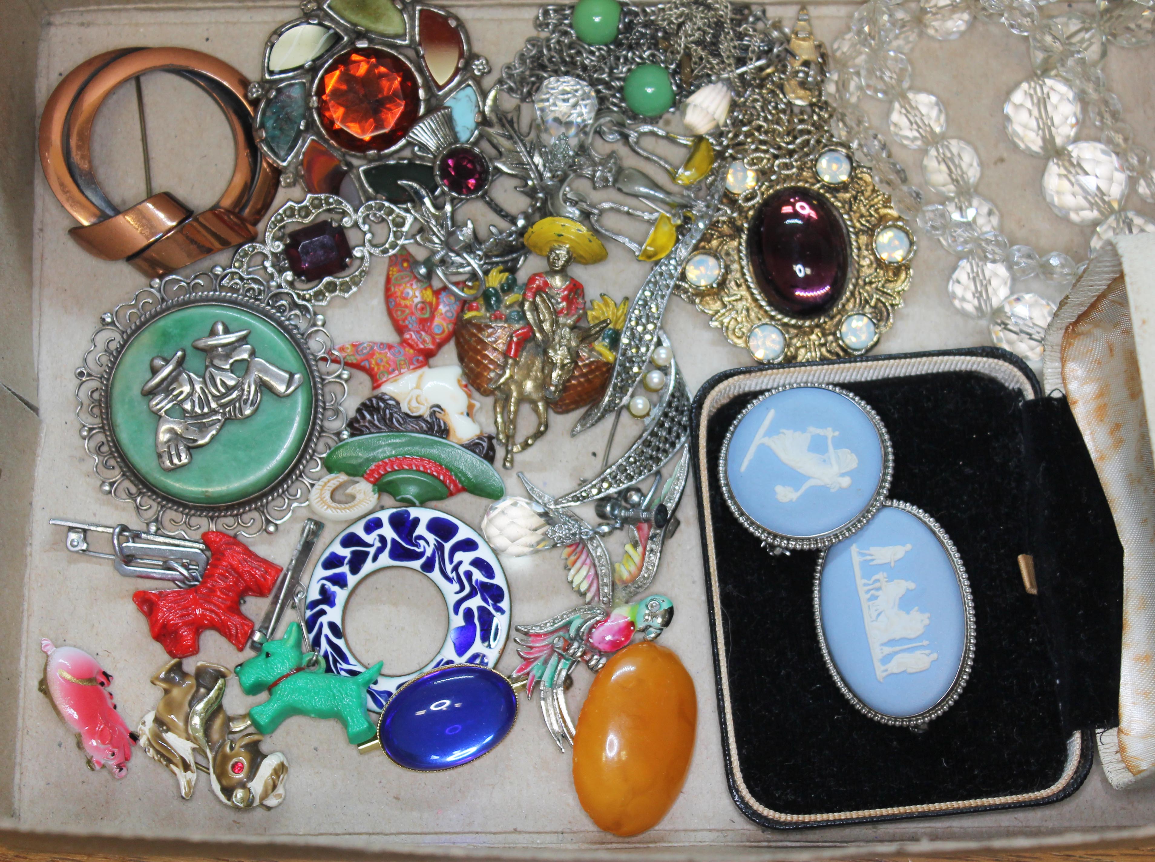 A box of assorted costume jewellery including Wedgwood cameos, animals, silver etc.