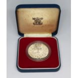 A Royal Mint 1977 silver crown.