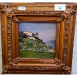 Early 20th century Italian/French school, oil on board, hilltop village with figurine, 15cm X