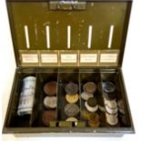 A vintage savings tin with old British / World coins and notes.