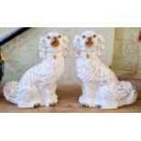 A pair of Staffordshire spaniel ceramic dogs.