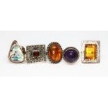 A group of five rings comprising four marked '925' stones comprising abalone, garnet and