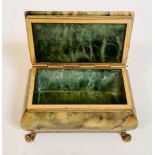 An Italian alabaster jewellery / trinket box with brass rim, on brass lion's feet.