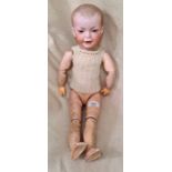 An antique S.F.B.J articulated doll with bisque head, open eyes, model 226, size 8.