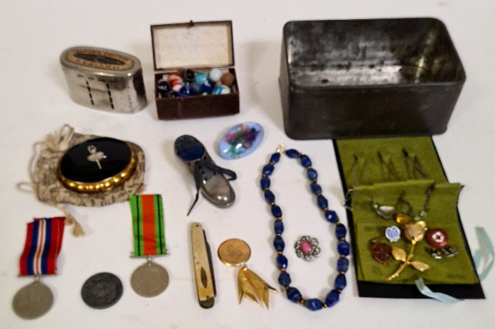 A box of collectables to include a Halifax money bank, a pin cusion in shoe, vintage marbles, 9c