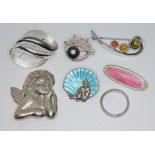 A group of silver and white metal jewellery including enamel, cherub etc. various marks.