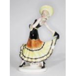 A Goldscheider style Art Deco figure of a woman in stylised pose, the base stamped 35293, height