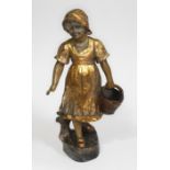 A Goldscheider terracotta and gilt highlighted figure of a girl holding a basket by B. Haniroff,