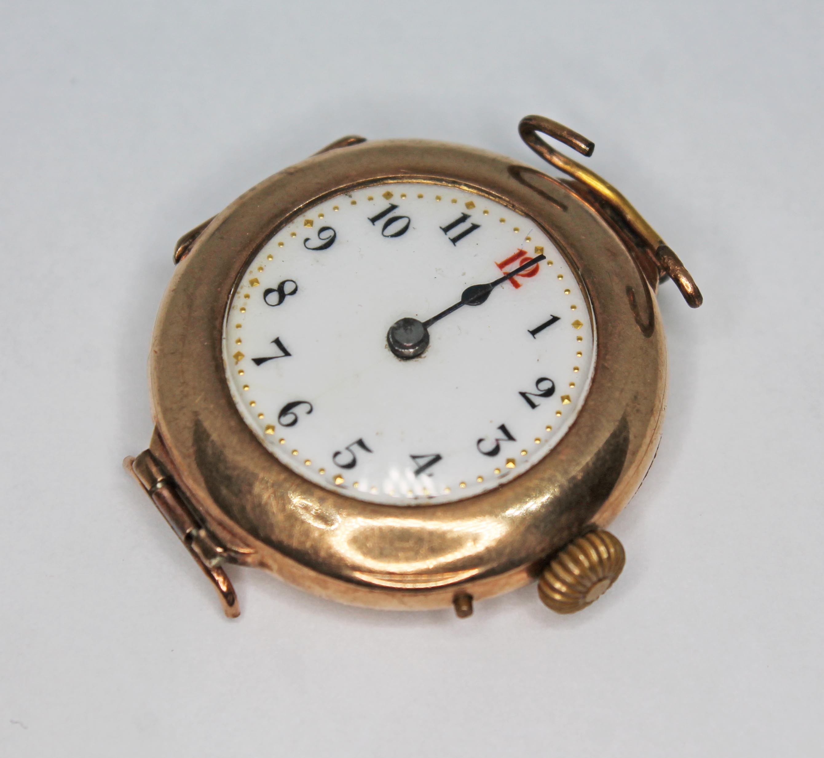 A hallmarked 9ct gold watch, enamel dial with Arabic numerals, diam. 28mm, gross wt. 18.70g.