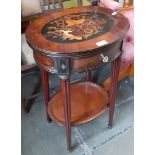 A 19th century continental inlaid mahogany and walnut sewing table with ebonised and brass string