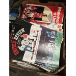 A box of mainly Manchester United football programmes.