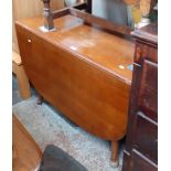 An oak drop leaf table.