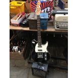 A Peavey Generation EXP electric guitar with Ibanez amp.