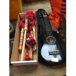 A Martin Smith soprano ukulele and a set of Junior playable bagpipes.