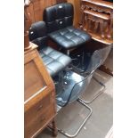 Two chrome and faux leather bar stools and two chrome and perspex dining chairs.