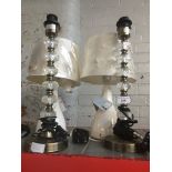 Pair of diamond cut tower table lamps and a pair of ceramic base lamps with shades.