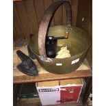 A large brass jam pan, 2 flat irons, a crinoline lady door stop, a small hand scale and a vintage