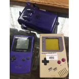 2 Game Boy consoles with Tetris and Pokemon games, 1 with case.