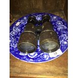 A pair of WW1 Lemaire Fabt Paris binoculars and a collectors blue and white plate depicting Martha