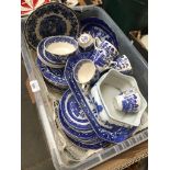 A crate of blue and white pottery