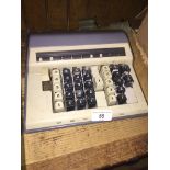 A vintage Contex adding machine, cca 1952, made in Denmark, in original case and box.