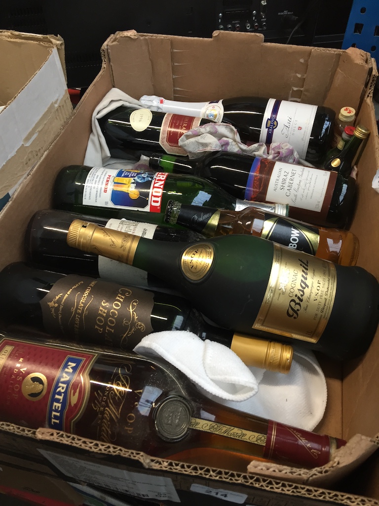 A box of alcoholic beverages to include cognac, etc.