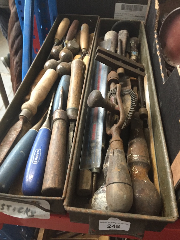 Two metal boxes of wood chisels, wood working tools and wood carvers.