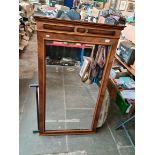 A large wooden framed mirror