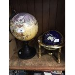 Two globes one made from various semi precious stones.