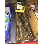 A mixed box of engineering tools and equipment.