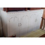 Two French style white painted wardrobes.