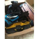 A box of bags and rucksacks to include Vanguard camera rucksack, Adidas holdall, North Face rucksack