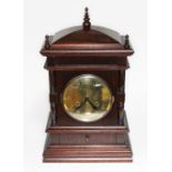 A dark wood mantle clock.
