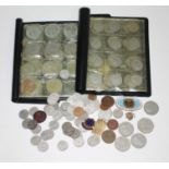 A collection of coinage and badges.
