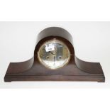 A domed top mantle clock.