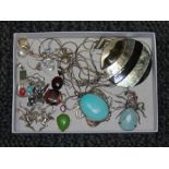 A tray of assorted jewellery including a spider pendant, a pair of nude pixie earrings, many items