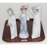 Three Lladro figures. Girl with Candle 4868; Boy from Madrid 4898; Boy Awaking 4870. All with