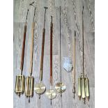 Collection of precision pendulums and others.