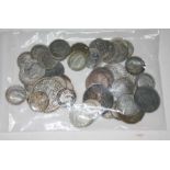 A collection of various silver coins, mostly threepenny bits.