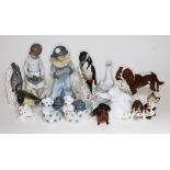 A group of 13 mixed figurers. Six Nao including pups in basket, Gorilla, goose, boy playing