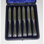 A cased set of six hallmarked silver handled knives.