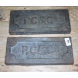 A pair of cast work plates 'P.C & Co'.